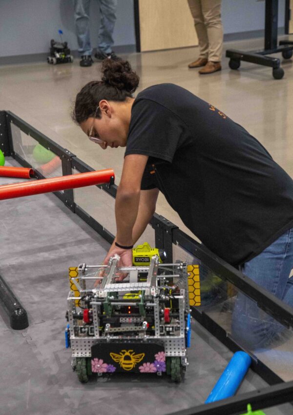 Texas City ISD Student using the robots