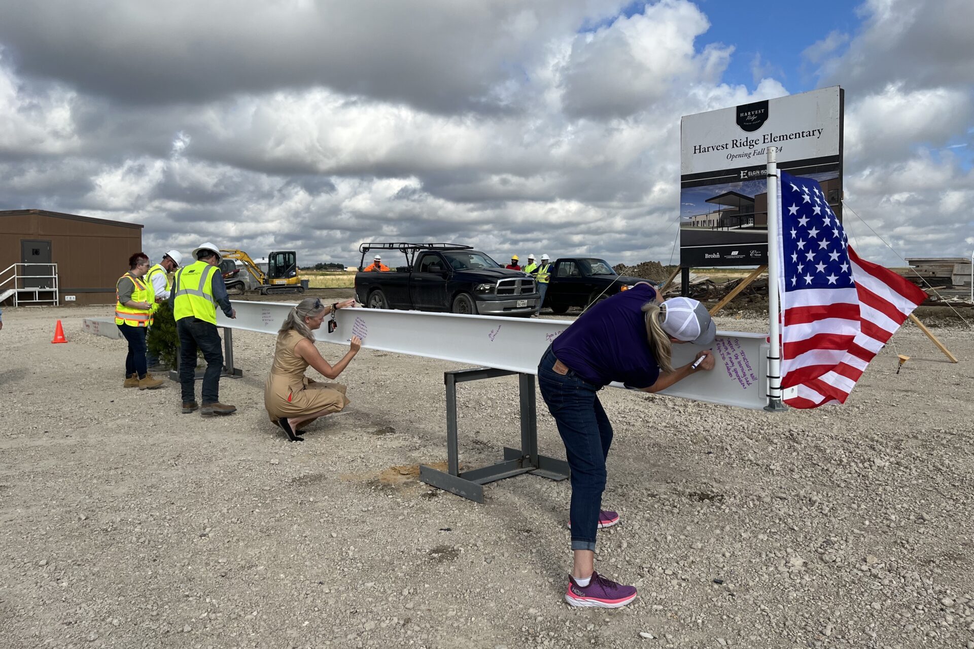 Jessica Molter signs beam at Topping Out Ceremony for Elgin ISD's Harvest Ridge Elementary