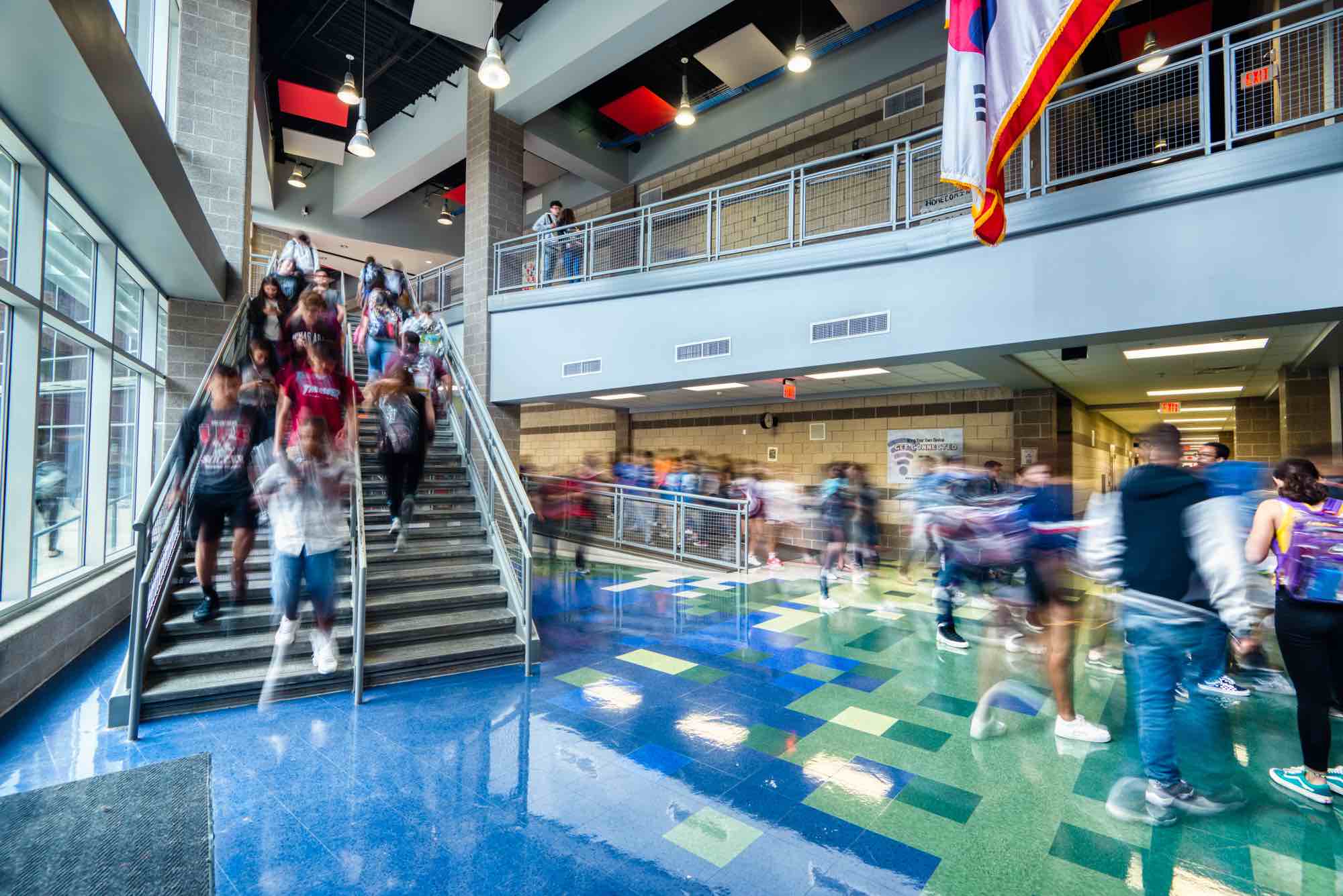 Two schools, one campus. Blending the red and gray of LEE High School with the blue and green of ISA High School.