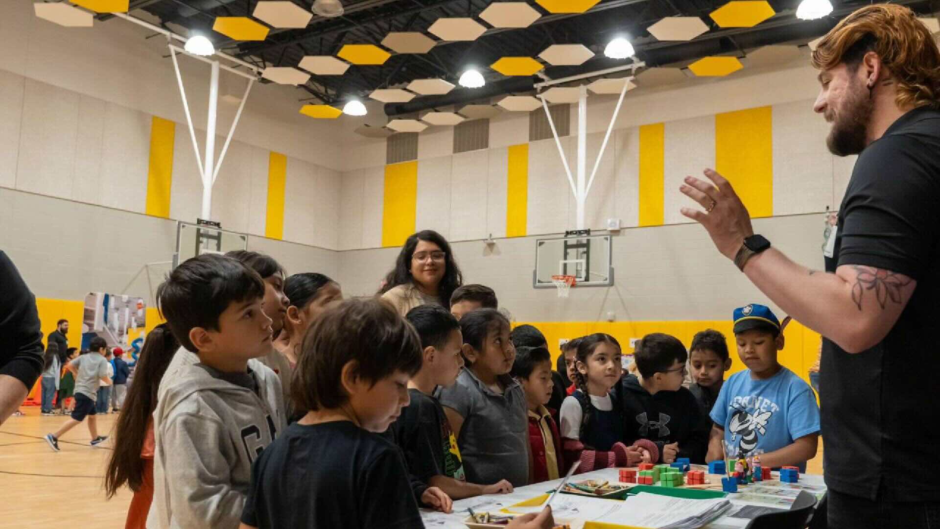 Man talking to elementary students at career day